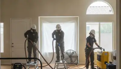 Riverside, CA water-damage restoration team inspecting flood damage in a commercial property